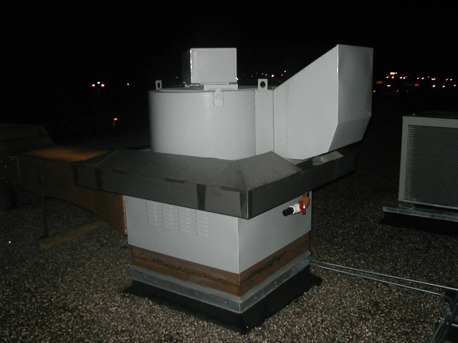 ViroGuard rooftop grease containment unit installed on an exhaust fan